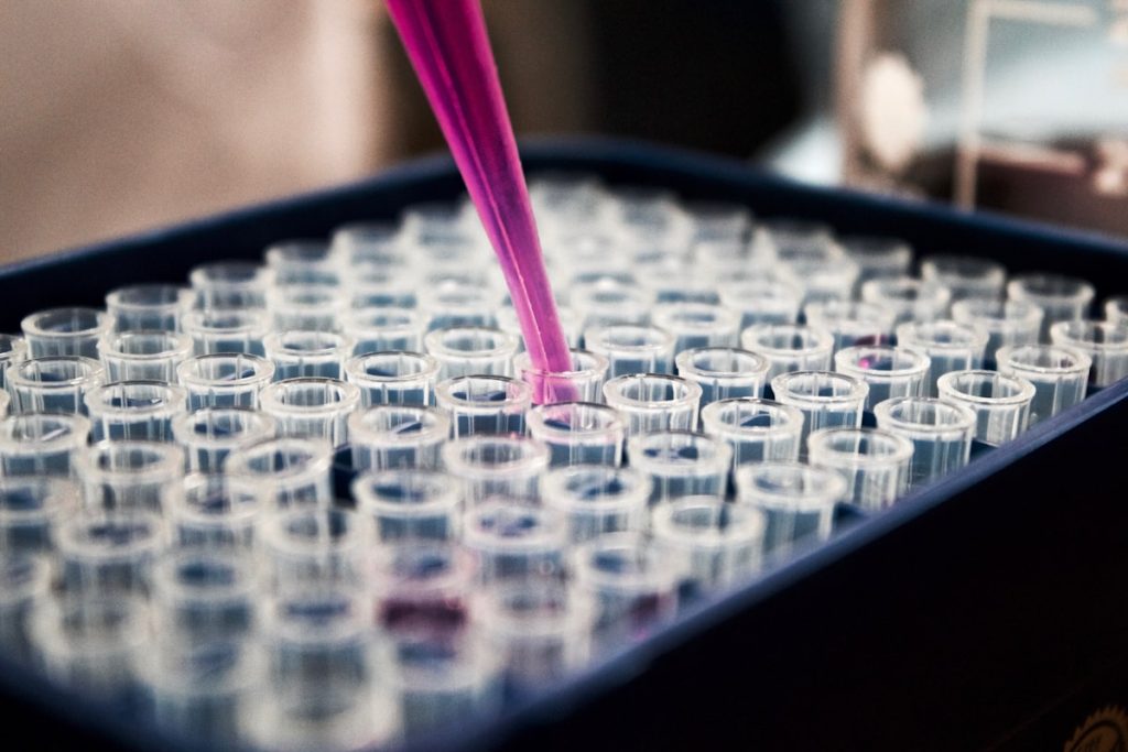 Colourful laboratory vials and research samples arranged in rows